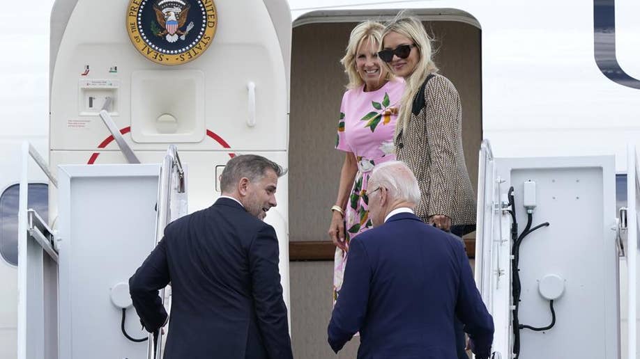 President Biden and his son climb staircase to Air Force One