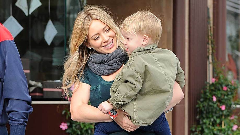 Hilary Duff holding her son Luca Cruz Comrie in 2013