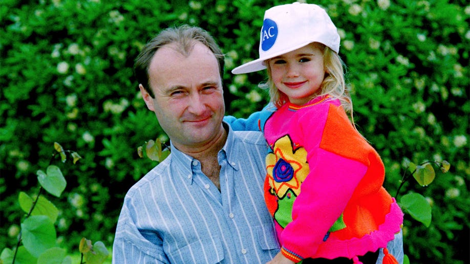 Phil Collins with daughter Lily Collins in 1988