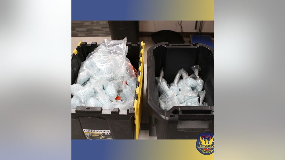 cartons filled with bags of fentanyl pills