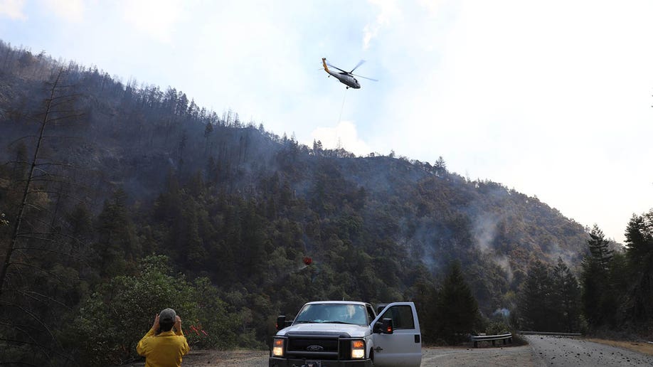 helicopter flying over Rum Creek Fire