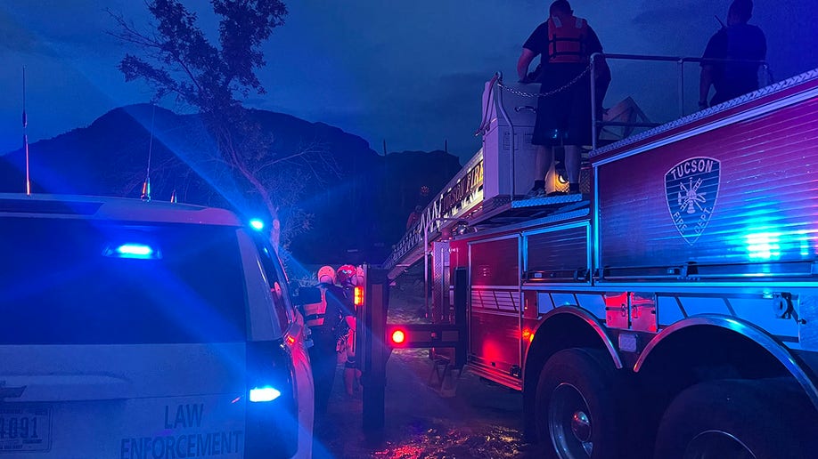 rescue crews at low water crossing