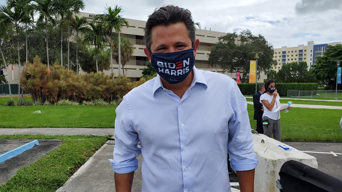 A photo of Sen. Jason Pizzo wearing a Biden/Harris face mask
