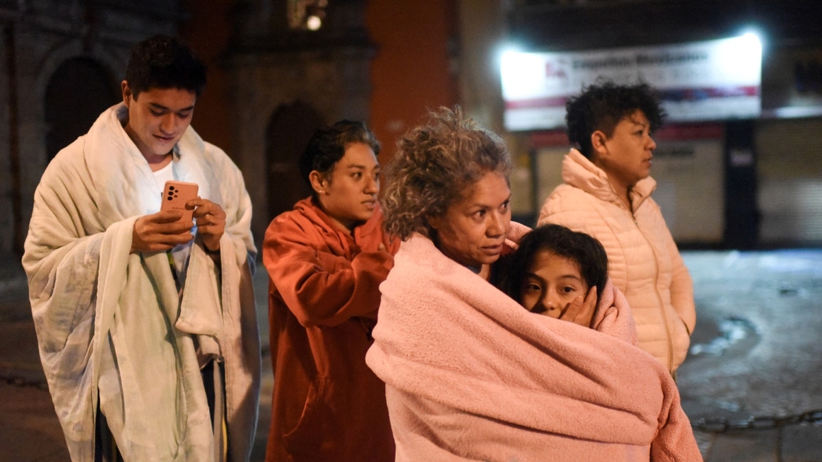 Mexicans stand in street after earthquake