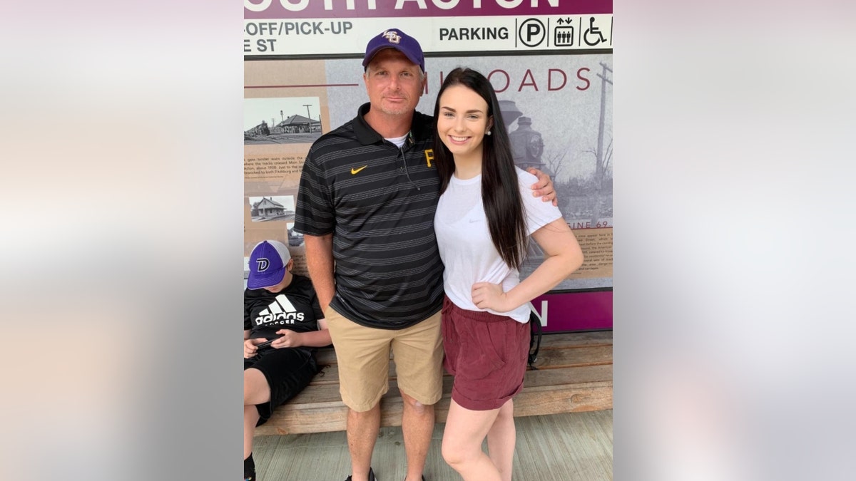 Allison Rice poses with her father in LSU gear