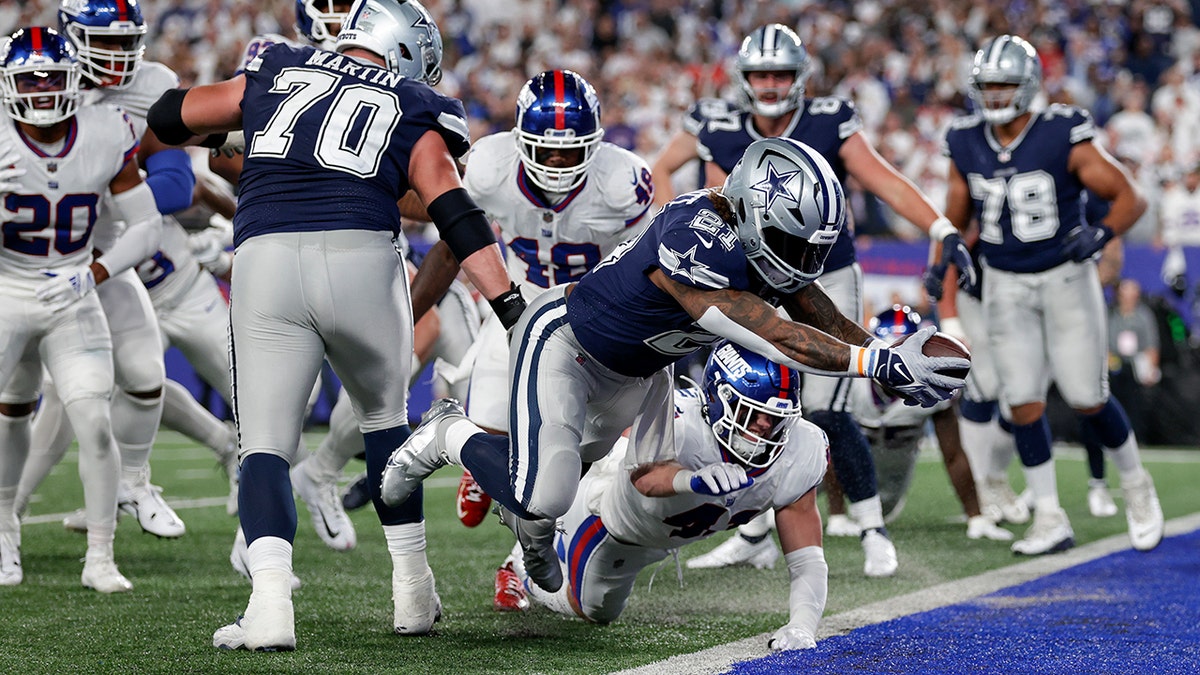 Zeke dives for a touchdown