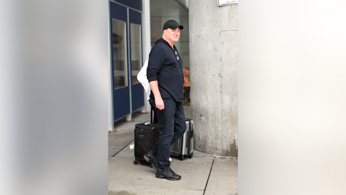Brendan Fraser walks through airport