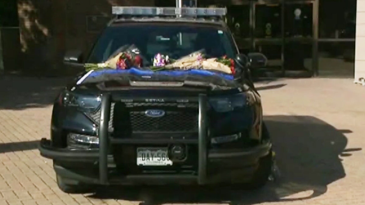 Squad car with flowers at Arvada PD in Colorado