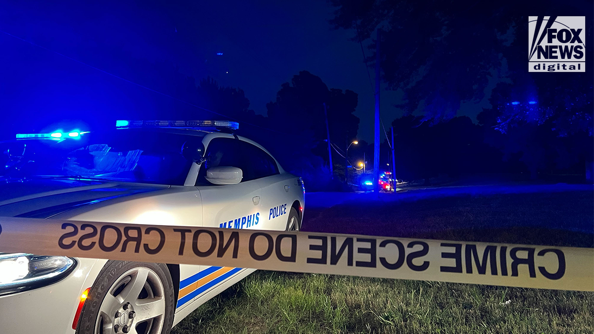 A police car sits outside an active crime scene in the search for Eliza Fletcher