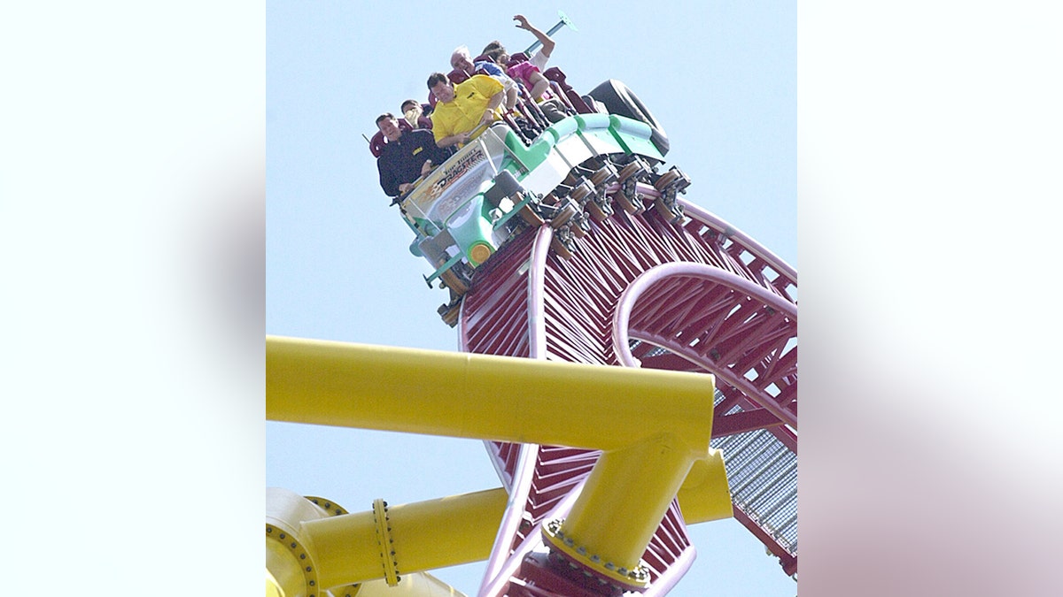 Riders go down a loop on Cedar Point's Top Thrill Dragster