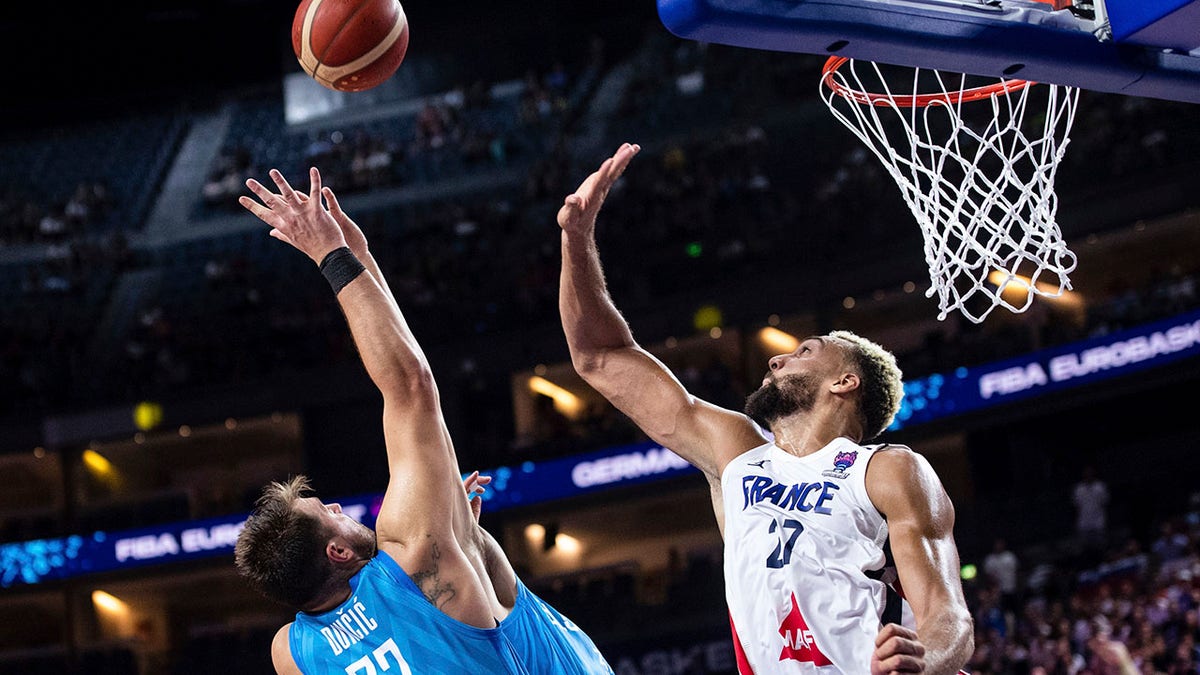 Rudy Gobert attempts to block a shot by Luka Doncic