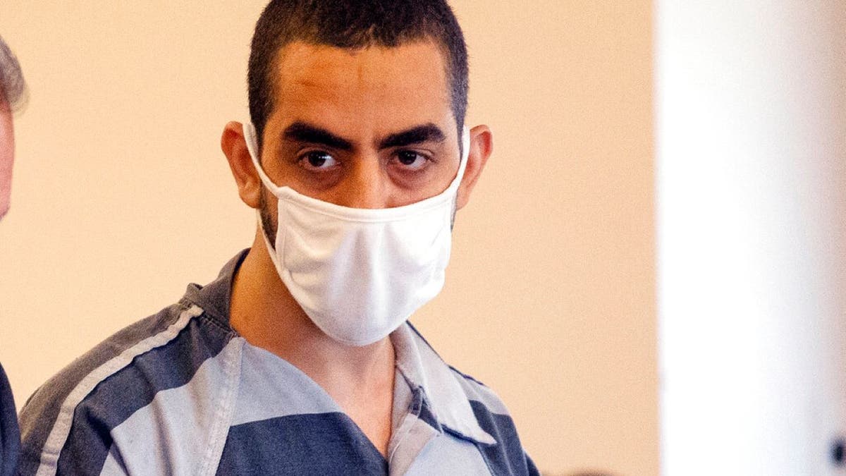 Salman Rusdhie stabbing suspect Hadi Matar in court wearing black and white jumpsuit
