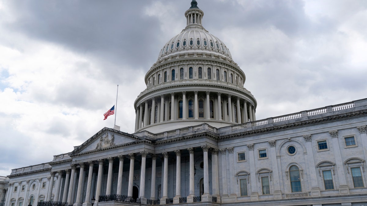The American flag flies at half-staff over the U.S. Capitol