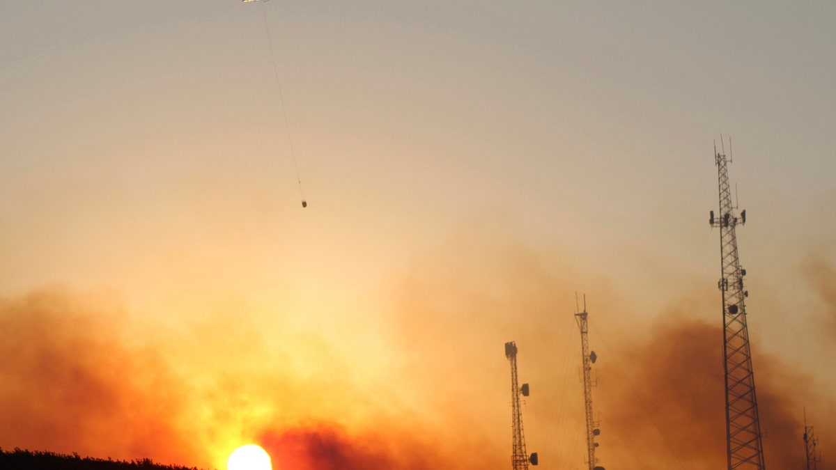 Helicopter carries water near Salem wildfire