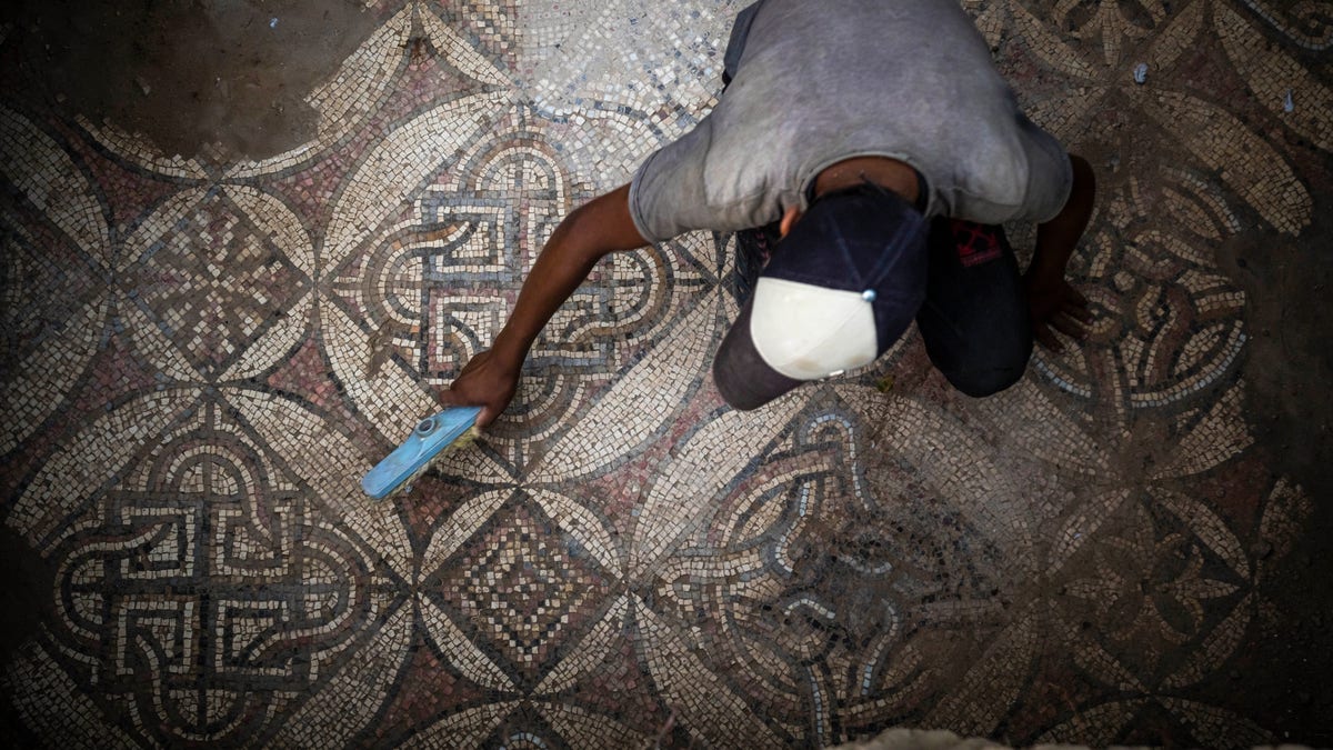 Man sweeps dust