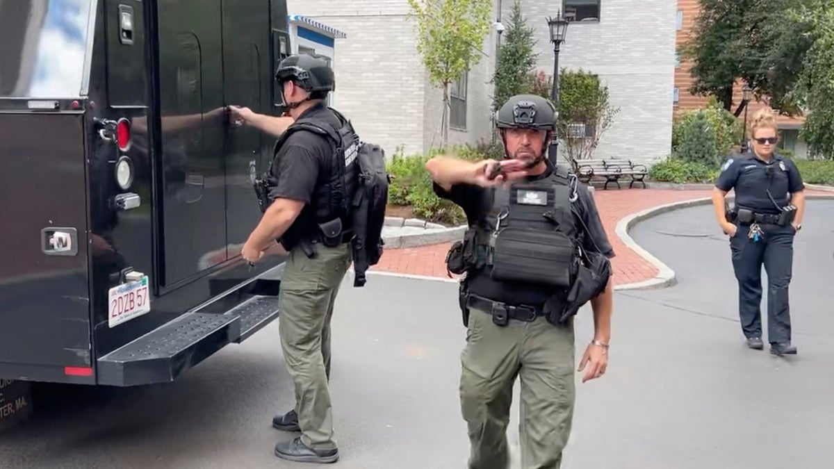 Boston Police bomb sqaud pushing reporters back