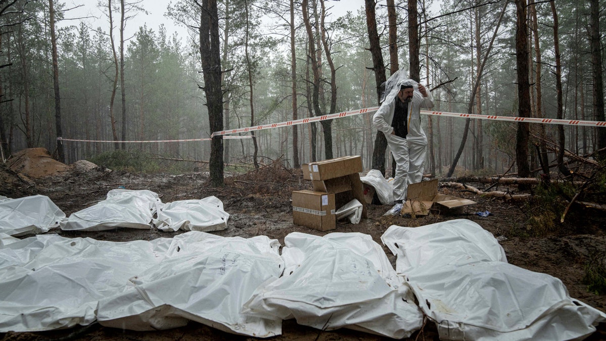 Top Ukraine official says 450 bodies found in Izyum mass grave, some with hands tied behind their backs