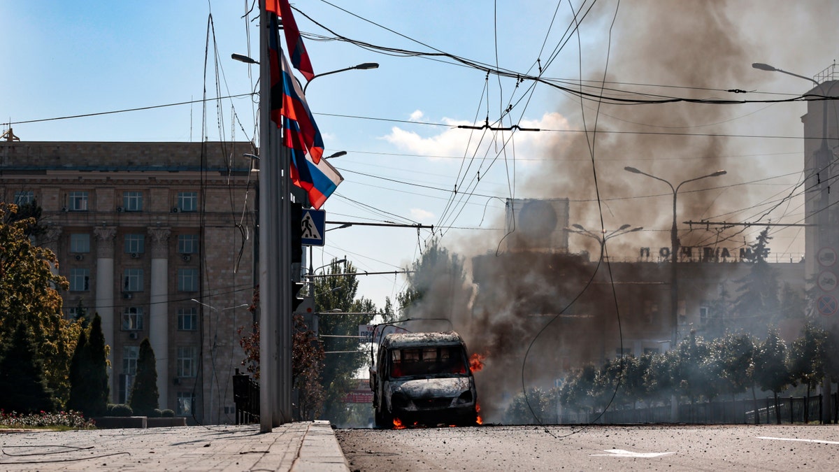 A vehicle on fire after shelling in Donetsk