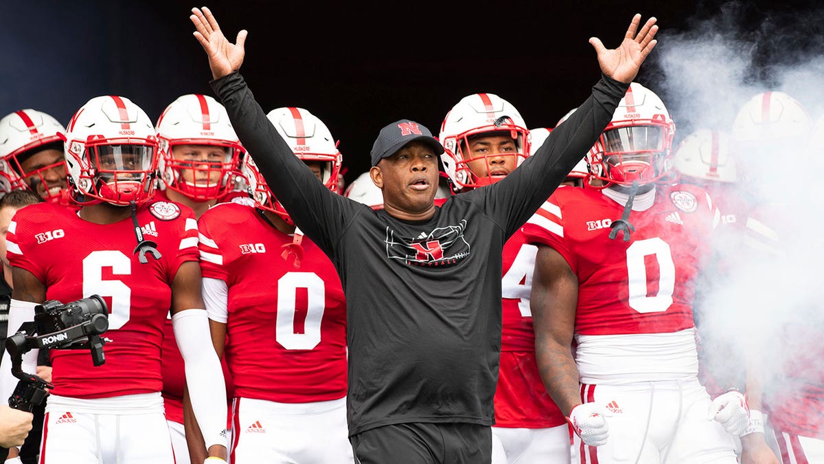 Mickey Joseph of Nebraska leads his team against Oklahoma