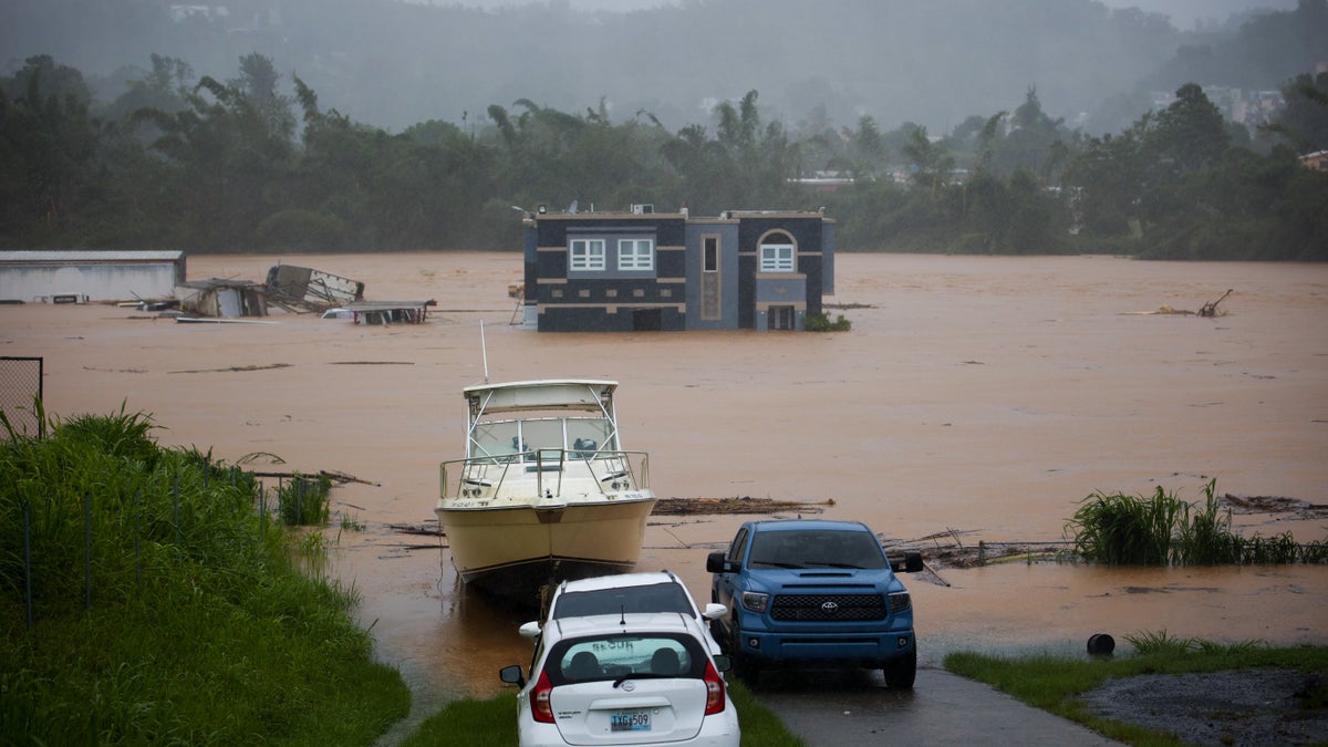 A home submerged in Puerto Rico flood waters