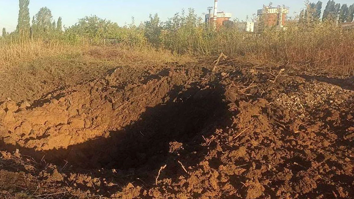 a crater left by a Russian rocket is seen 300 meter from the South Ukraine nuclear power plant