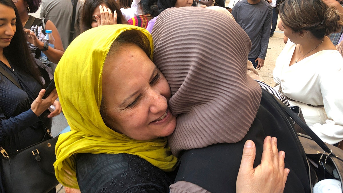 Adnan Syed's mother hugs supporter