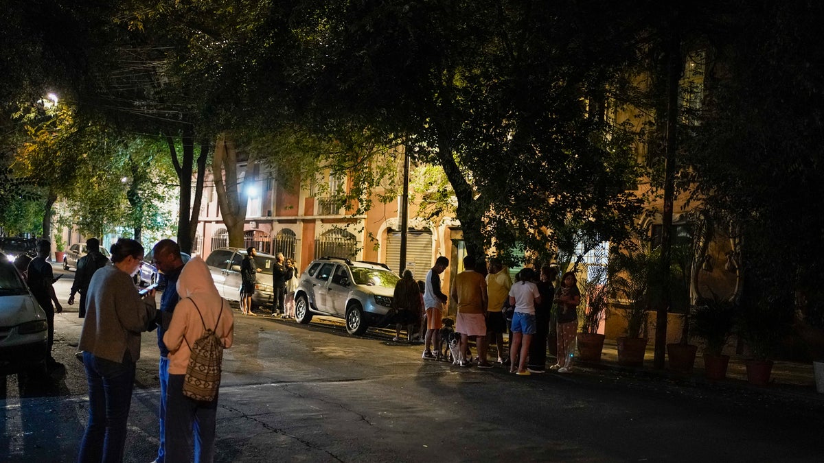 People standing outside after an earthquake in Mexico City