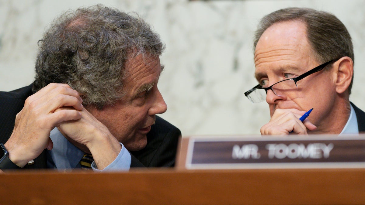 Sherrod Brown and Pat Toomey converse