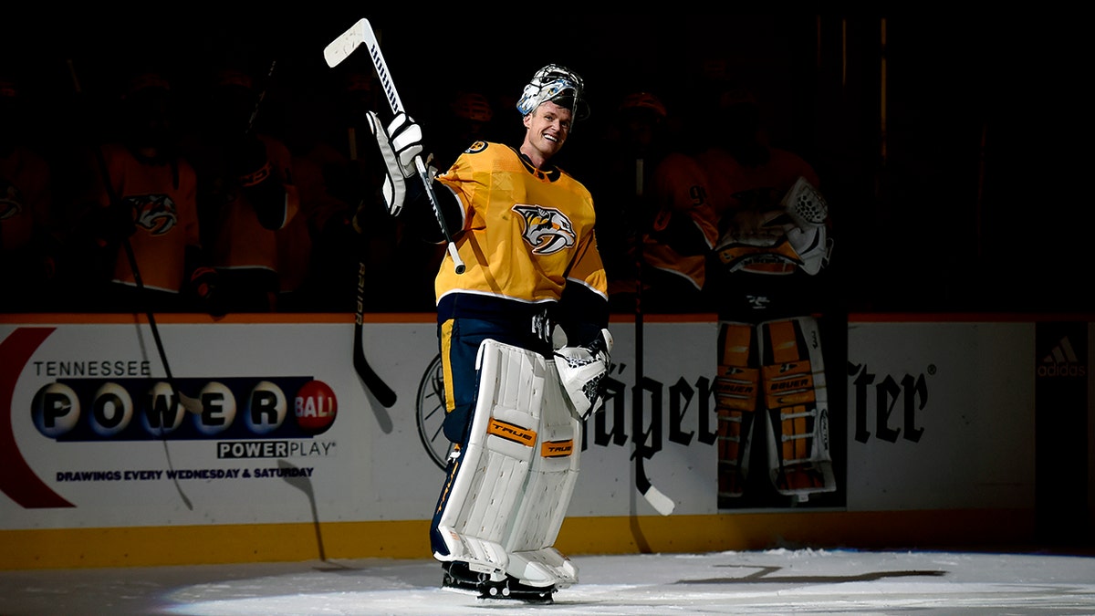 Pekka Rinne waves to the crowd during a standing ovation at a Nashville Predators game