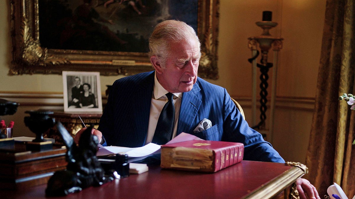 King Charles at desk