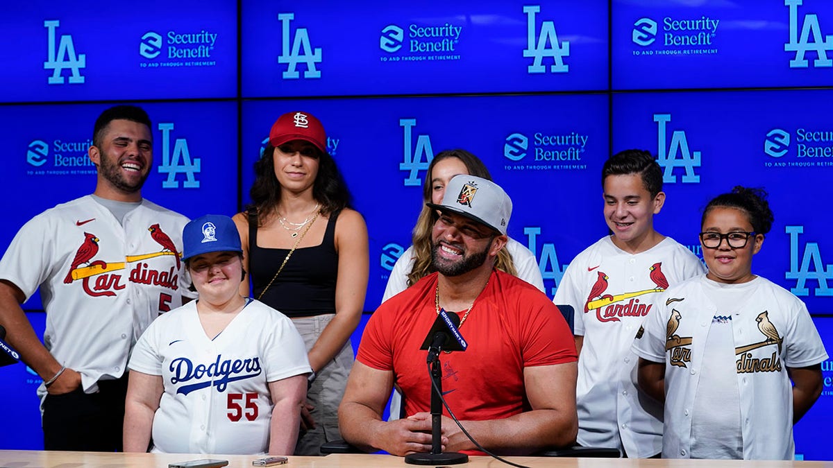 Cardinals slugger Albert Pujols with his family after hitting No. 700