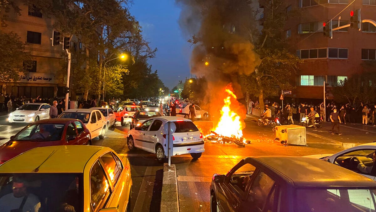 Tehran car fire protest iran