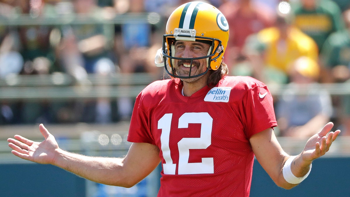 Aaron Rodgers smiles at Packers training camp in 2022