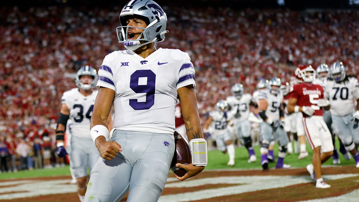 Adrian Martinez celebrates a touchdown