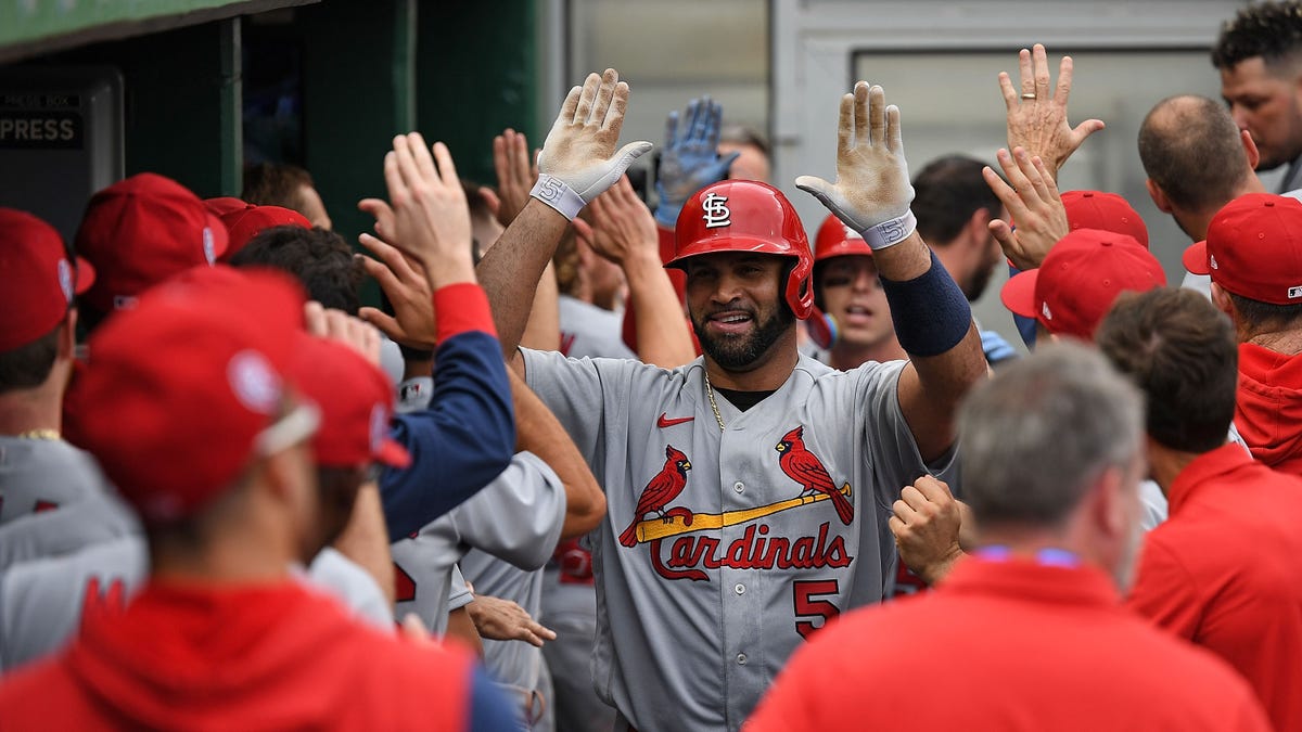 Albert Pujols celebrates with teammates