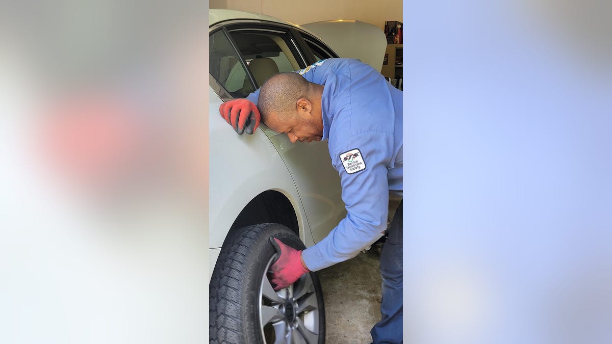 Allamby during auto repair work