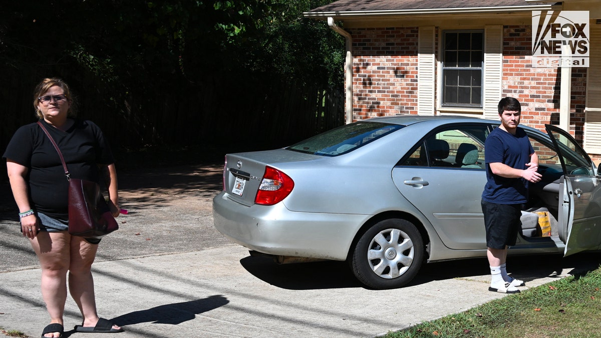 Amanda Bearden and Andrew Giegerich in driveway