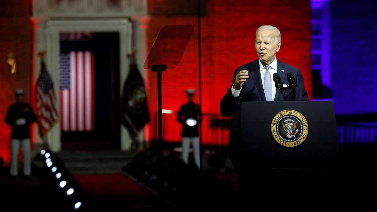 Biden seen delivering a speech in Philadelphia while flanked by Marines