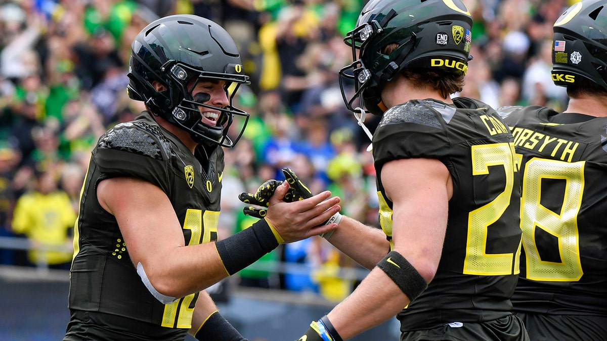 Oregon QB Bo Nix celebrates