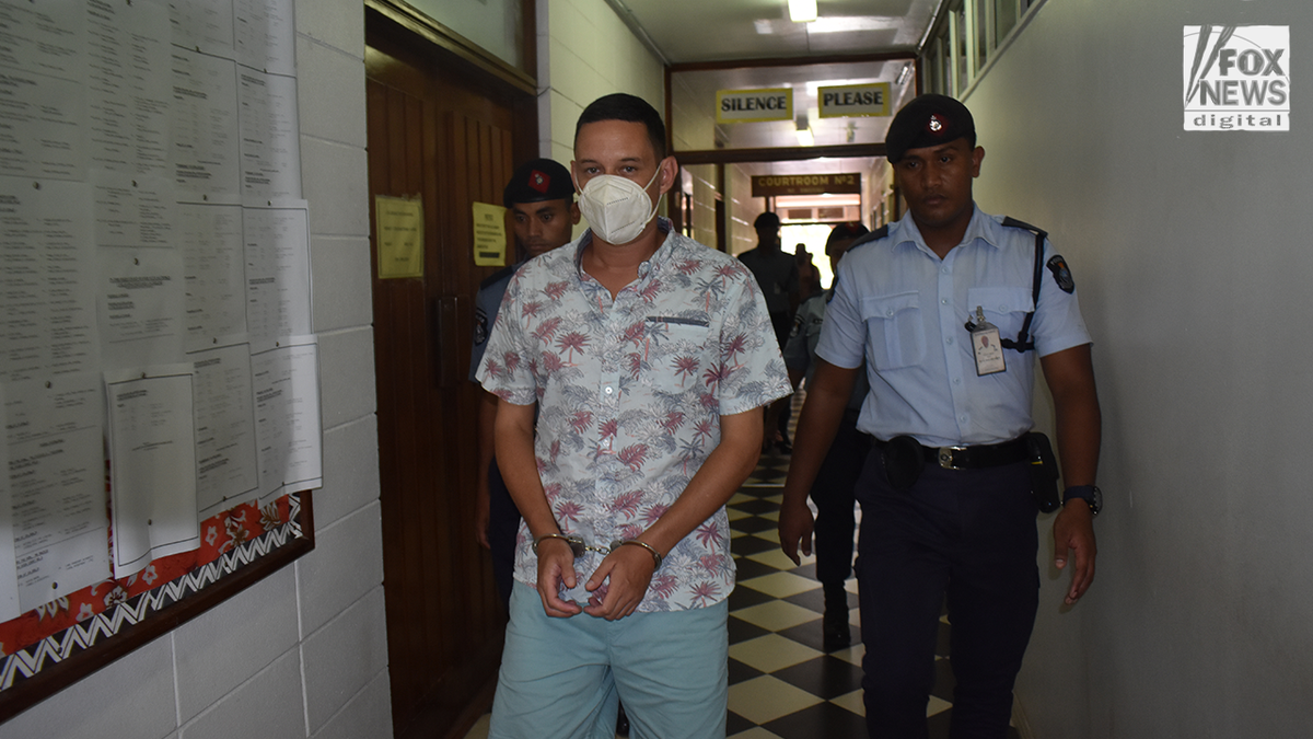 Bradley Dawson walking back to jail in Fiji