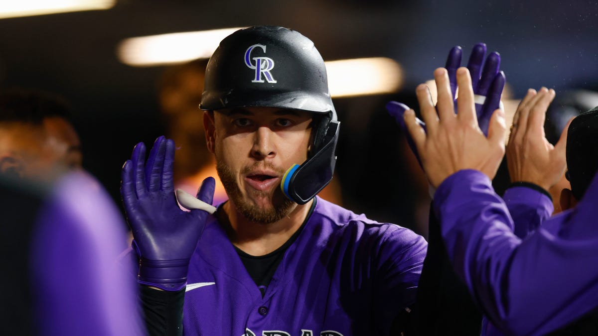 C.J. Cron celebrates with teammates