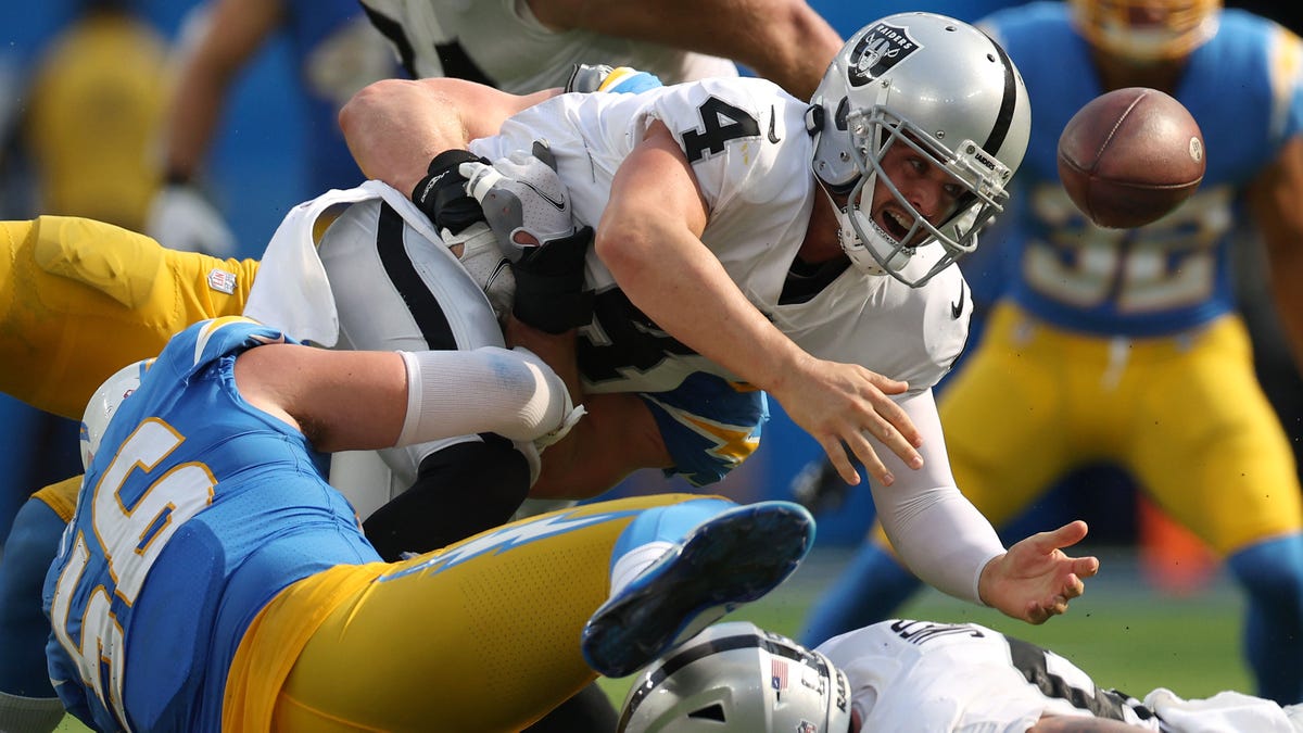 Derek Carr fumbles