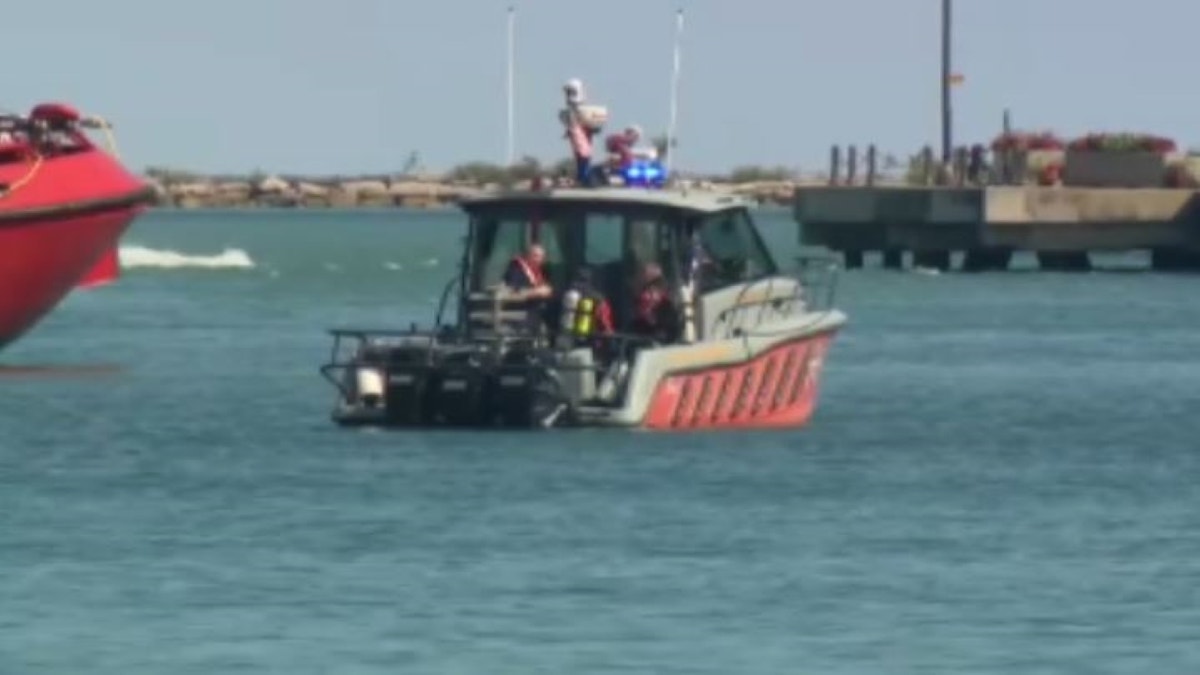 Police boat in water with lights on