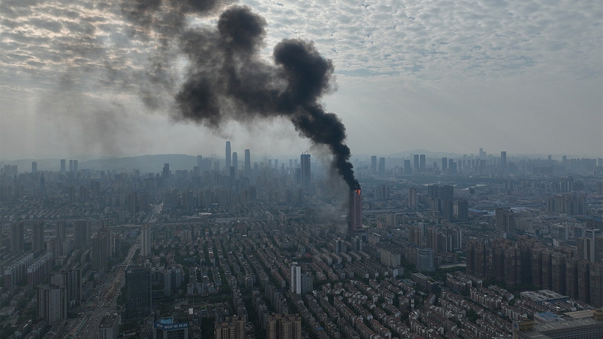 Chinese skyscraper erupts in flames