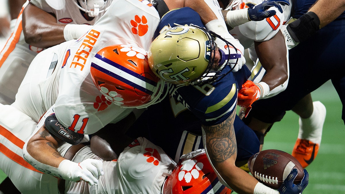 Clemson and Georgia Tech players collide