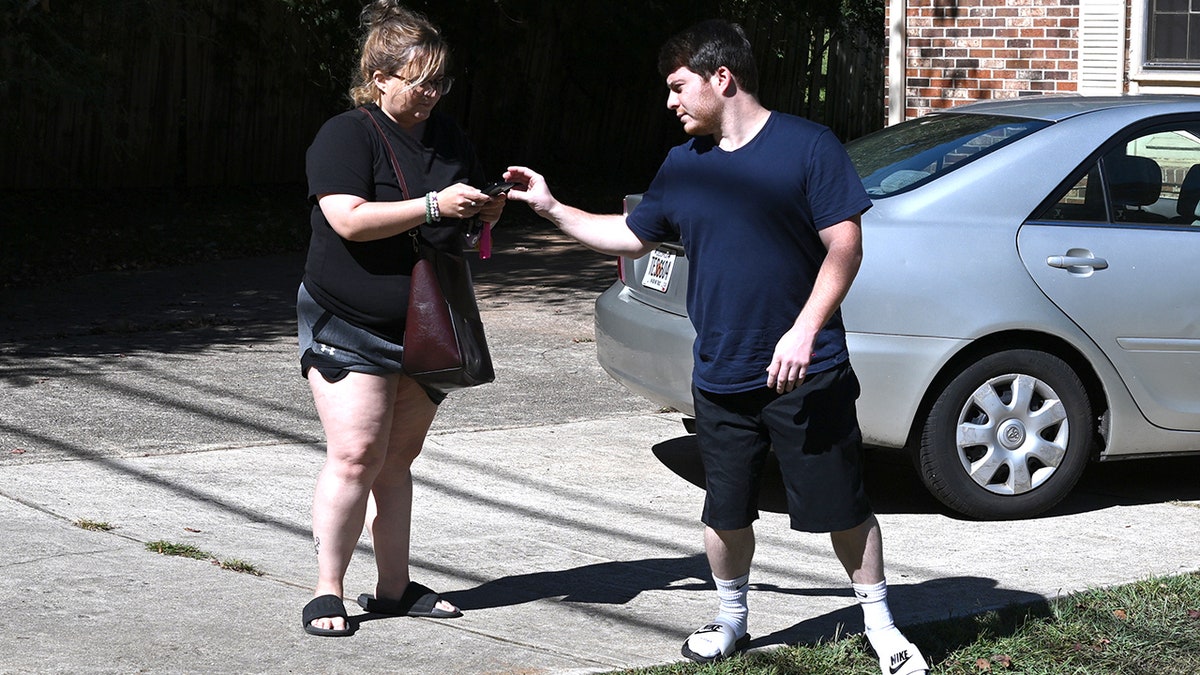 Amanda Bearden and her boyfriend, Andrew Tyler Giegerich in their driveway