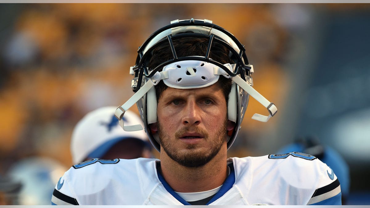 Dan Orlovsky with helmet on head