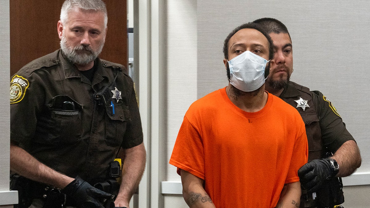 Darrell Brooks wearing an orange jail-issue T-shirt and pants