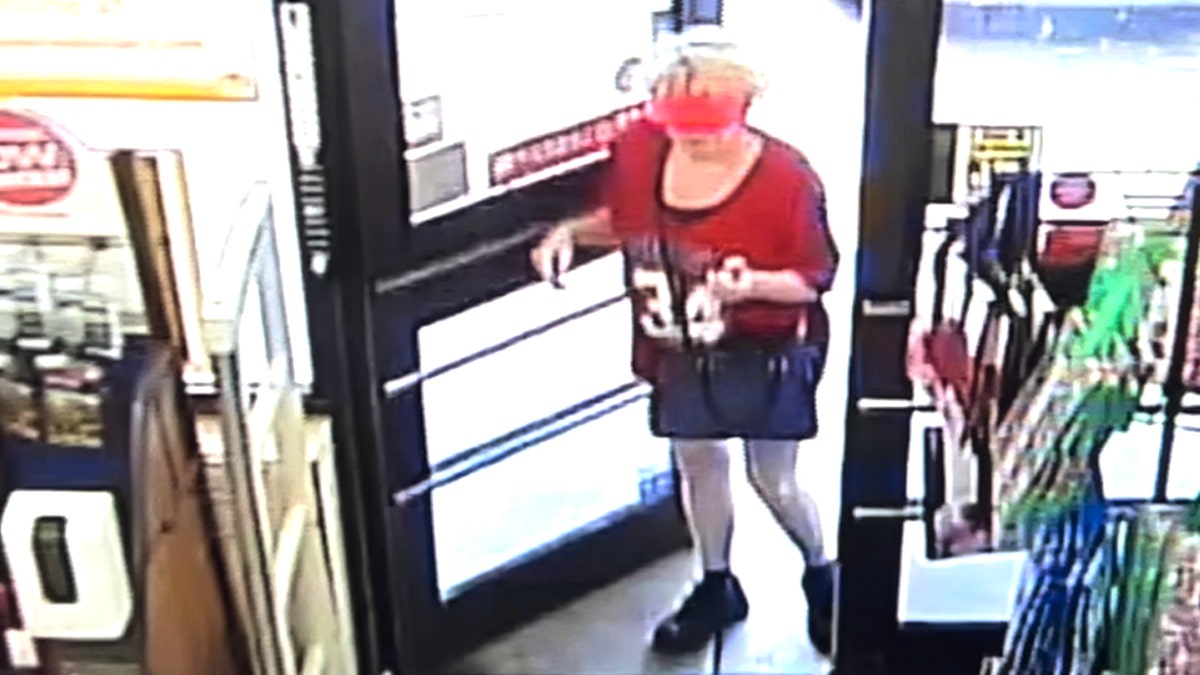 Debbie Collier enters store holding purse and keys