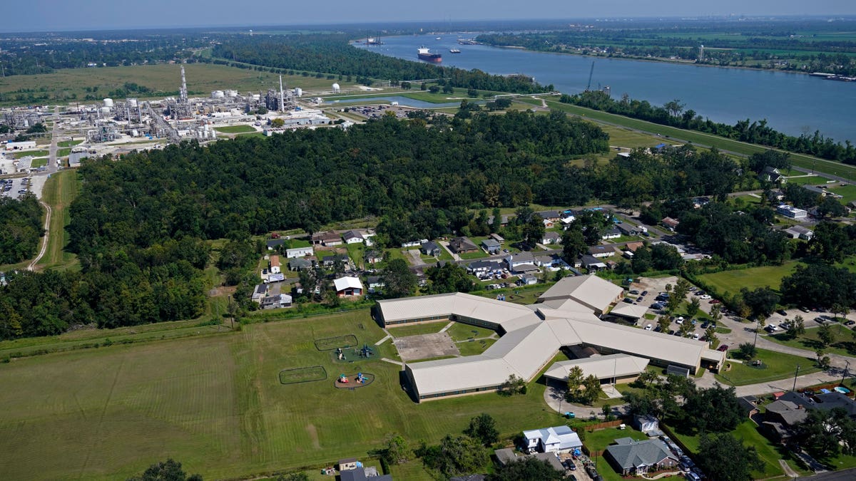 Arial view of neighborhood, school, and the plant